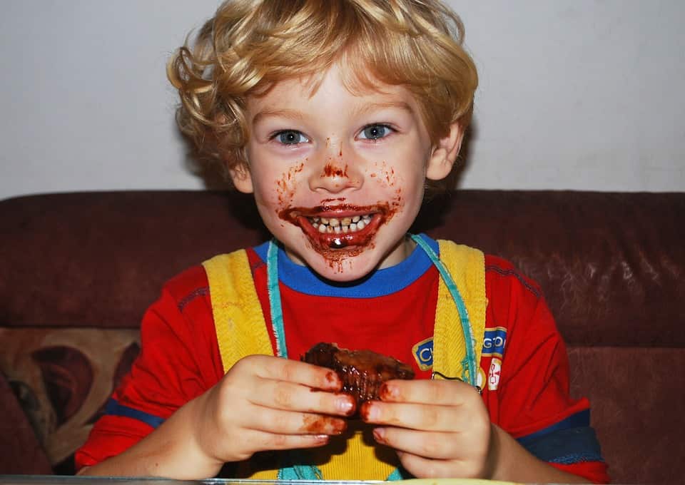 kid eating chocolates