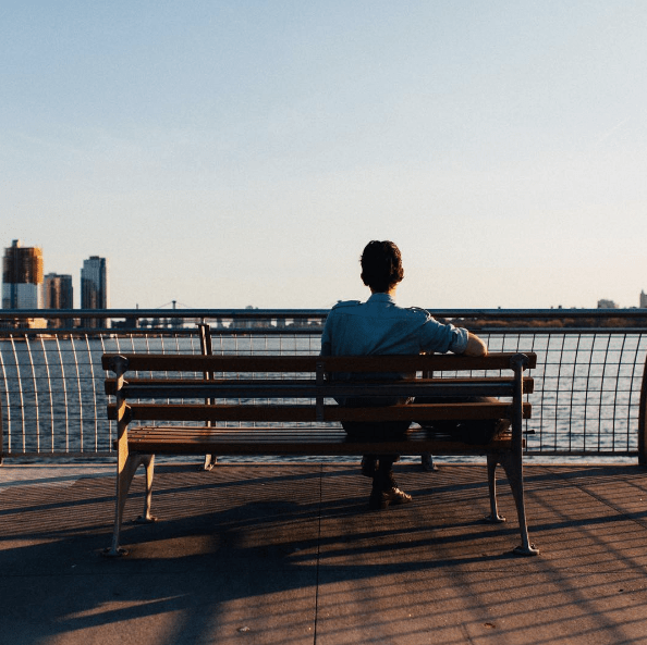 Man sitting on a bench in Brooklyn